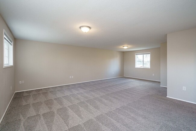 Building Photo - Recently Updated with Wood Laminate Flooring and Fresh Paint