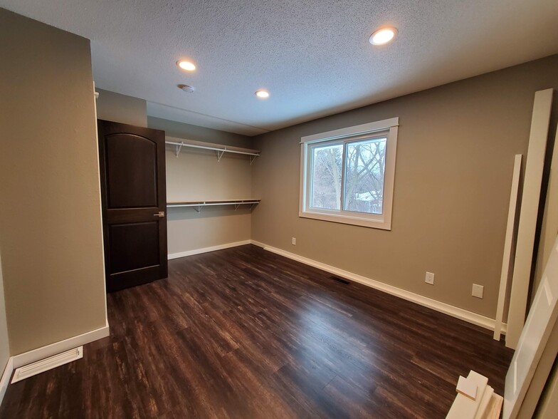 Second bedroom located on the main floor. Closet doors have now been installed. - 2525 Cedar Hills Drive