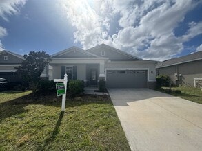 Building Photo - Where Modern Comfort Meets 4BD/3BA Hometown Charm — Your Story Begins in Okahumpka! FULLY-FENCED!...