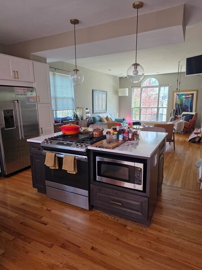 Building Photo - Stunning 3–4 Bedroom Townhome in Private Community | Garage + EV Charger | Deck with Tree Views