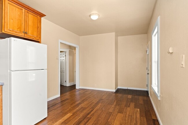 Building Photo - Utilities Included! Bright 1BD w/ Granite Kitchen & Plank Flooring