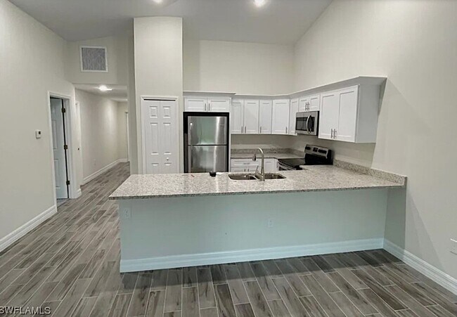 Building Photo - 3/2/1 - GREAT LOCATION IN LEHIGH ACRES- BELL BLVD