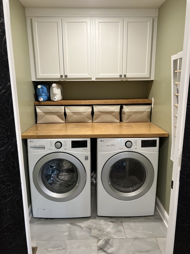 renovated laundry room with decorated french doors. - 2053 Jackie Lorraine Dr