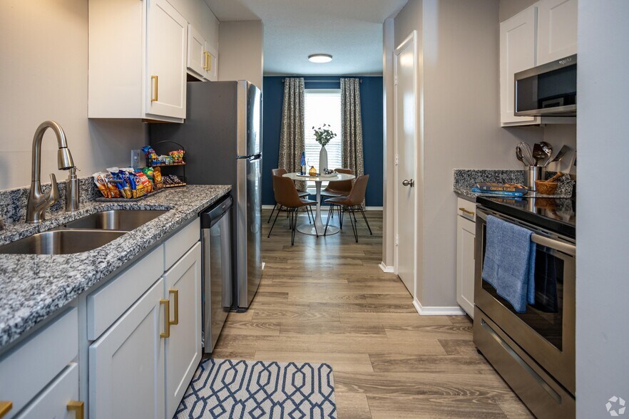 Kitchen with granite counters and stainless appliances - Ivy at West Hills