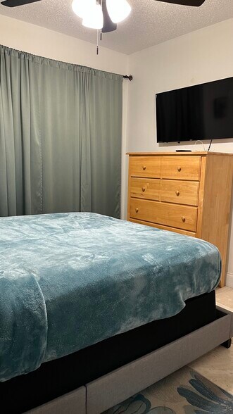 TV in guest bedroom - 19700 SW 103rd Ct