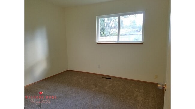Building Photo - Beautiful Remodeled Rambler!!!  Come enjoy this HUGE backyard!!  NEW CARPET!!