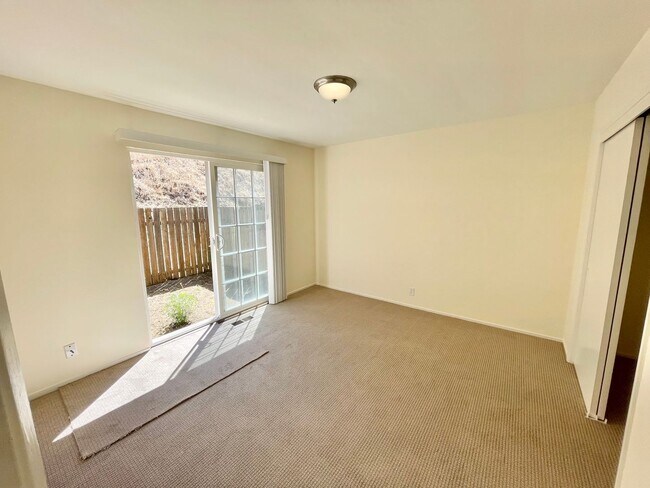 Building Photo - Sunlit 2BD/1BA w/ Private Balcony + Backyard! New Carpet! Assigned Parking! PROGRESSIVE
