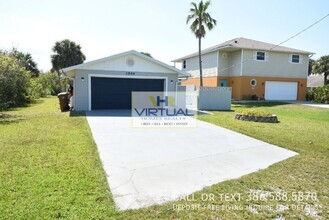 Building Photo - FULLY FURNISHED AND FENCED. Lawn care incl...