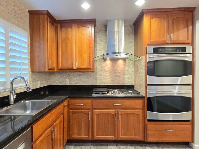 Building Photo - Large Campbell Home, Remodeled Inside, Gorgeous Kitchen, Large Master Suite, A/C, Beautiful Yards!