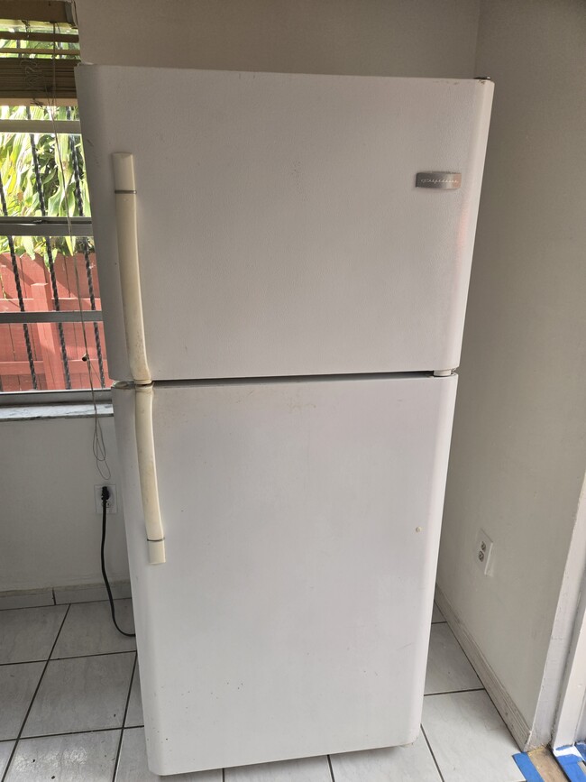 Medium sized refrigerator. - 4045 SW 107th Ct