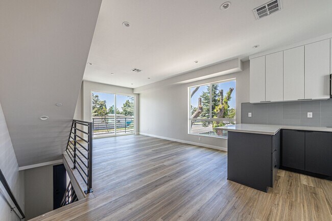 Building Photo - Contemporary 4-Bed, 4.5-Bath Townhome with...