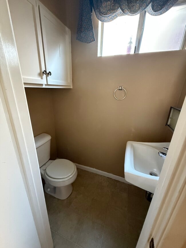 Guest half bath on the main level for added convenience - 1134 W Huntington Dr