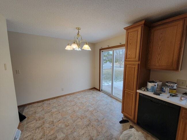 Building Photo - 4 BD, 2 BA - FENCED IN YARD, PRIVATE TRAILS, FINISHED UPPER AND LOWER LIVING AREAS, ATTACHED GARAGE!