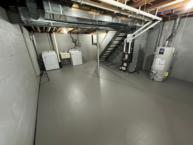 Basement with washer/dryer and lots of storage - 27 Farmbrook Dr