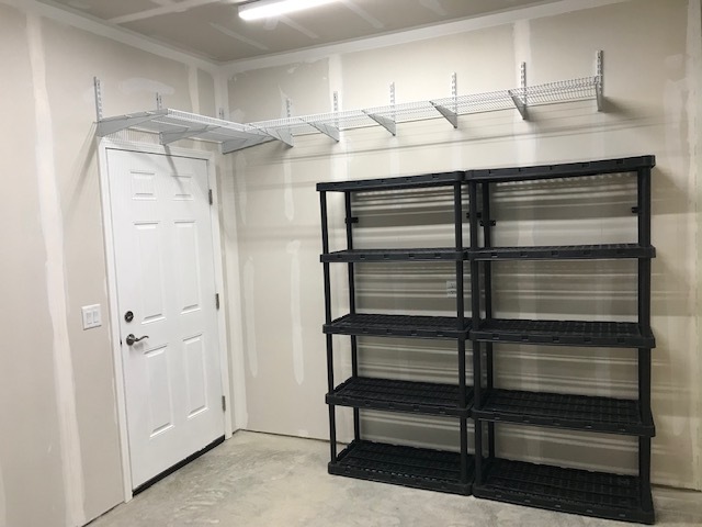 Apartment garage shelving storage. - 2225 Middleton Beach Rd