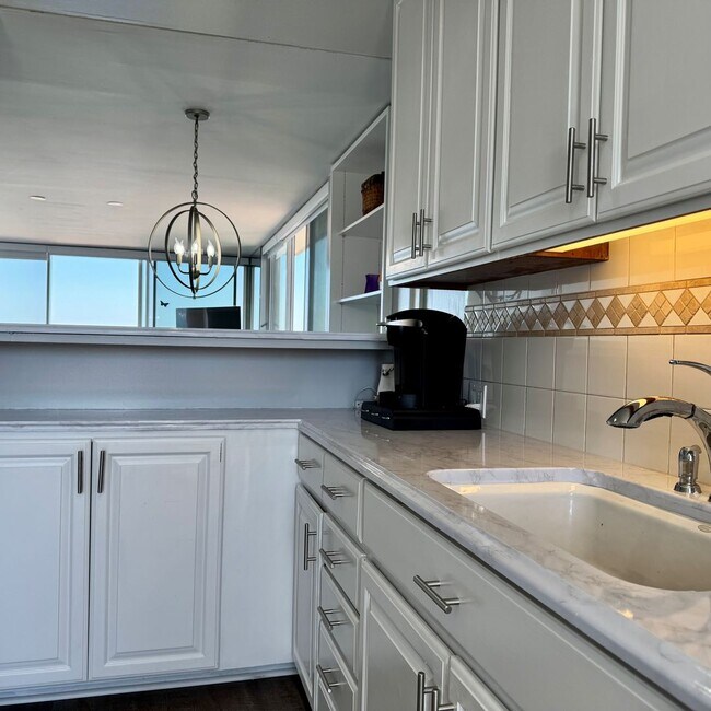 Building Photo - Just Unpack, Pour a Beverage, & Cue the Su...