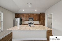 Building Photo - COMING SOON! 3BD/2BA Energy-Efficient Duplex | Granite | Island Kitchen | Garage | Yard Care Incl...