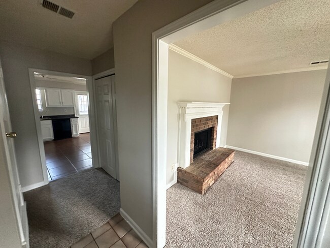 Building Photo - MOVE-IN READY! 3BR/2BA in Quiet Cove | Brick Fireplace | Fenced Yard & Patio!
