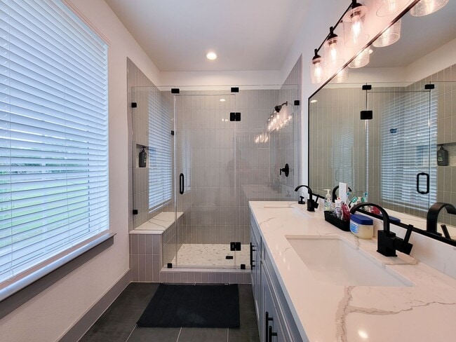 Building Photo - This 4-bedroom, 3-bathroom, two-story residence comes with a generous two-car attached garage. Re...