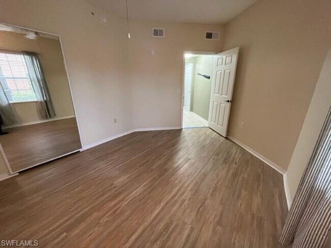 Building Photo - Gardens at Beachwalk - Unit 111