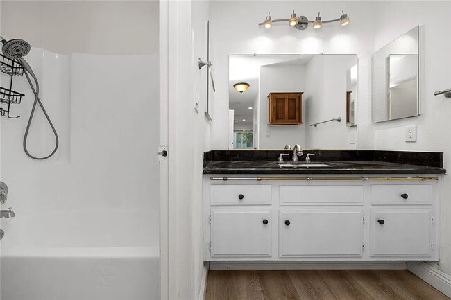 Building Photo - "Charming 1-Bedroom Furnished Retreat with...
