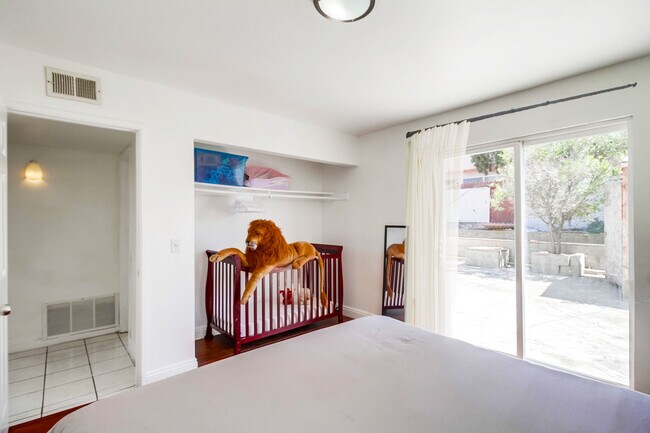 You and your baby will get plenty of sunshine in this master bedroom - 2304 E 14th St