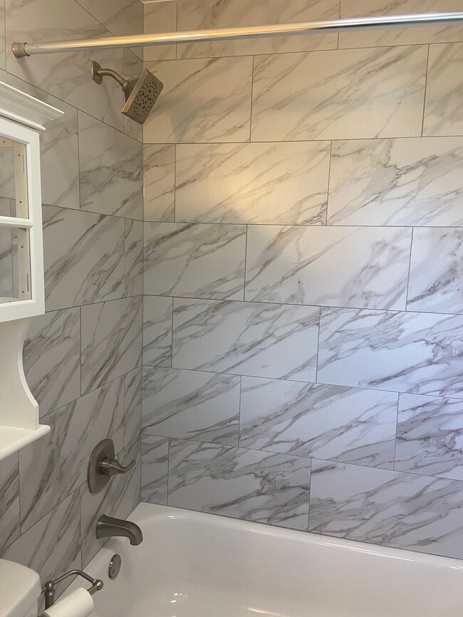 Owners' Suite en-suite bathroom with new vanity, toilet, lights, blue tooth exhaust fan, and storage - 174 Brisbane Ave