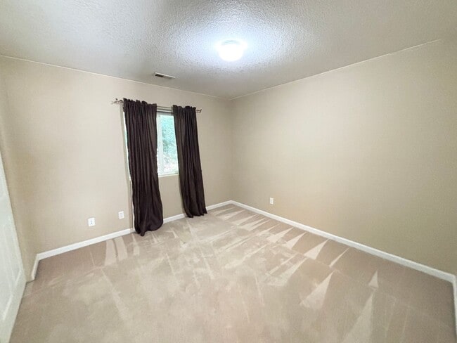 Building Photo - Stunning Remodeled Home with Office, A/C, Fenced Yard & Flexible Living Space!