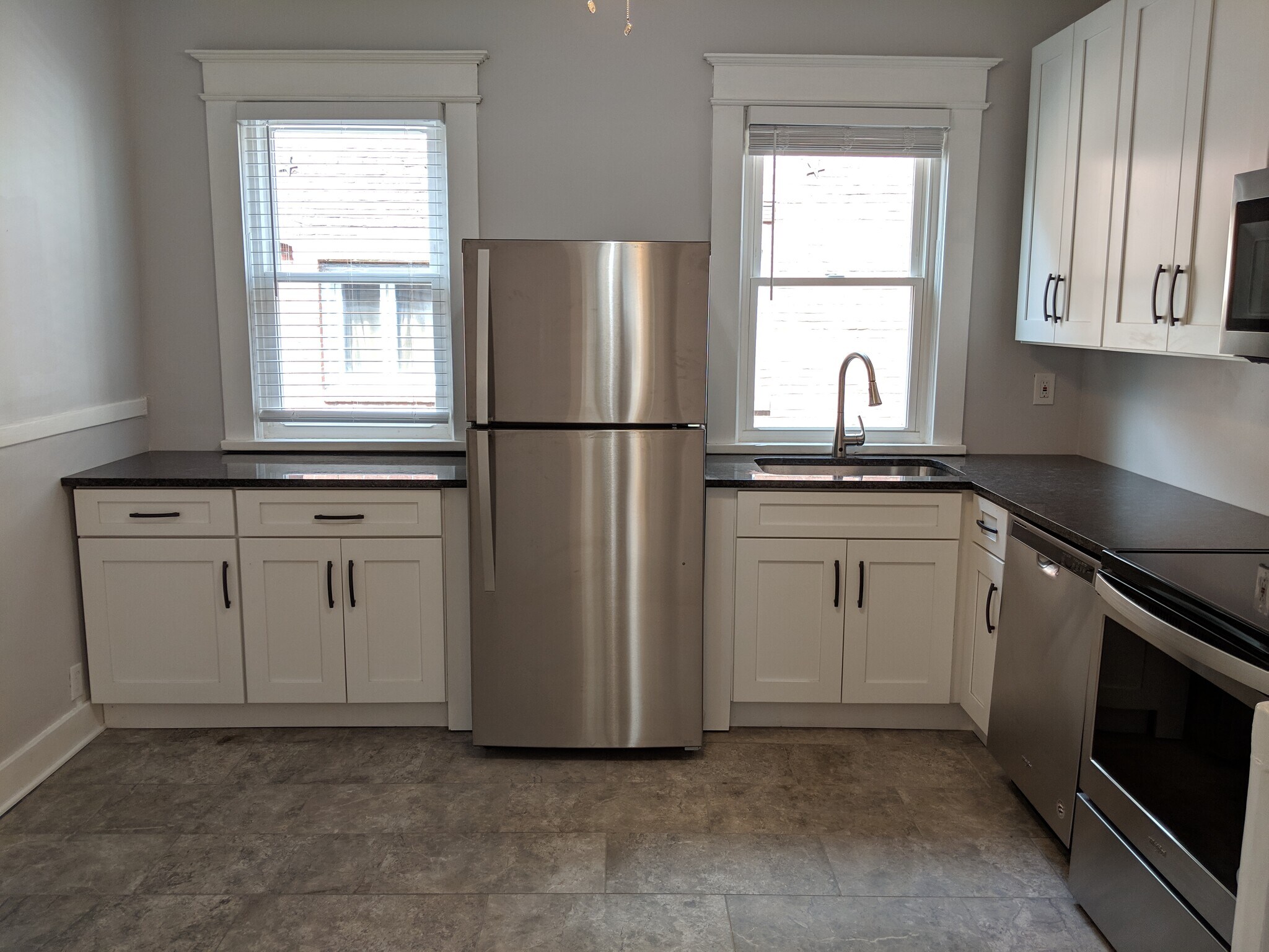 Kitchen with brand new stainless steel appliances and granite countertops - 32 Pawling Avenue