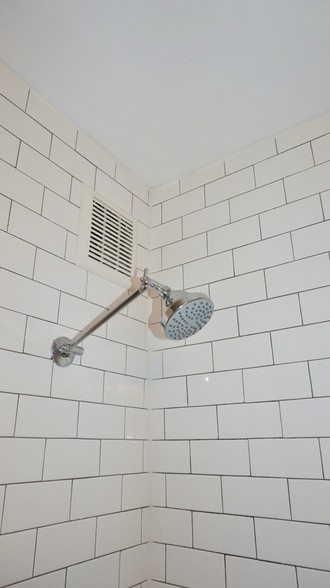 tiled shower/tub with new shower head - 70 S Cedar St