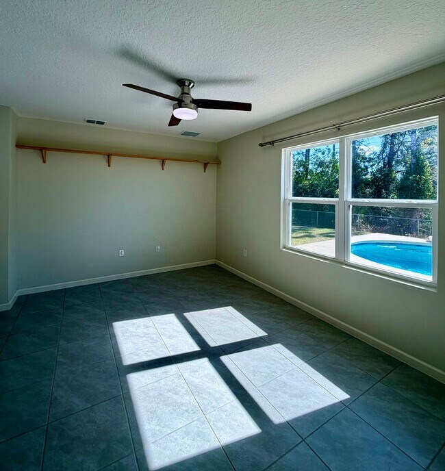 Building Photo - Palm Bay Pool Home Stunner!