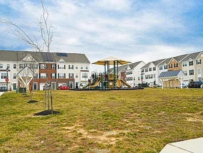 Building Photo - Stunning 3-Story Brick-Front Townhome | Modern Living + Military & First Responder Discount