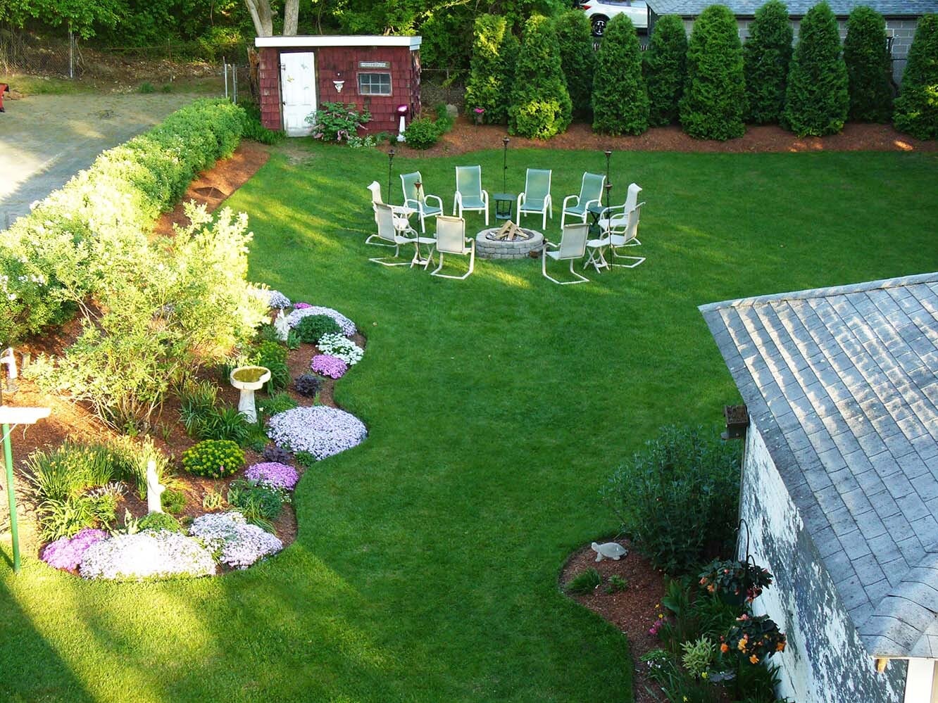 Beautifully landscaped yard with fire pit for tenant's use - 216 5th St