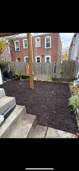 Fenced back yard freshly mulched - 155 Sheldon Ln