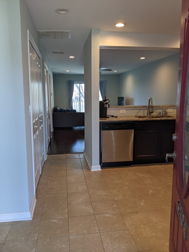 Walk into the kitchen which leads to the living area. - 2414 Lake Park Rd