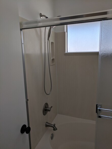 Master Bath - shower with upgraded Delta valves, faucet and shower head, with hand held accessory. - 14101 N 78th Dr