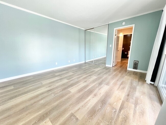 Building Photo - Contemporary 2 Bed Condo with 2 Garage Parking Spaces, Community Pool, and 3 Private Balconies