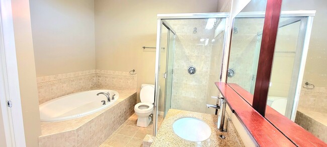 Mater bathroom with standing shower and tub - 9254 Elm Vista Dr