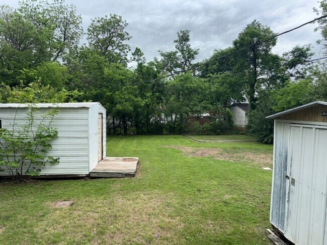 Building Photo - EXTRA STORAGE SPACE IN BACKYARD