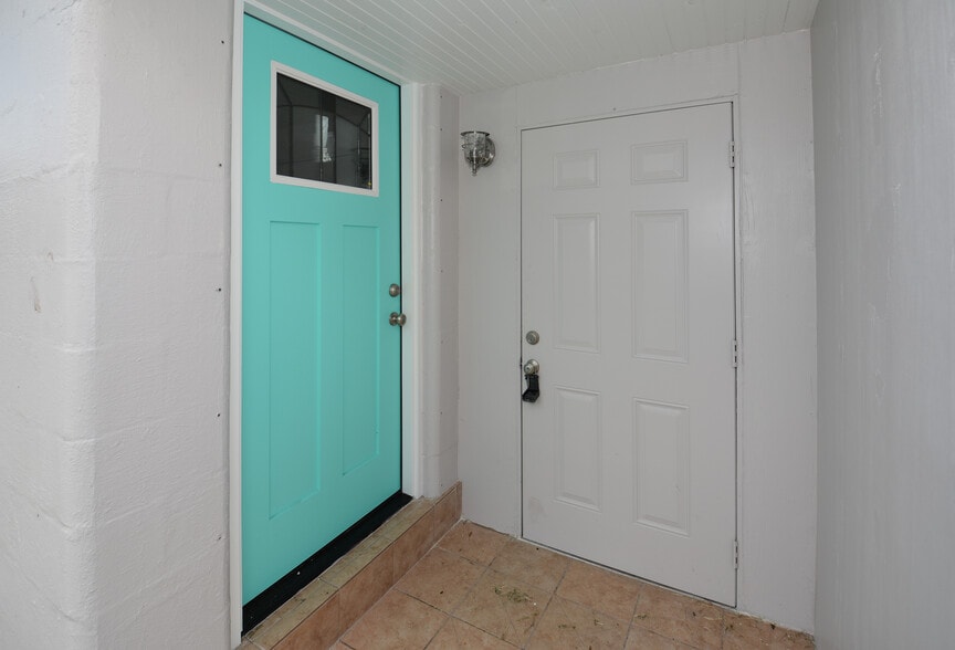 Front door to unit - property is back unit of triplex. Laundry room is behind the door to the right. - 5009 TANGERINE AVE S