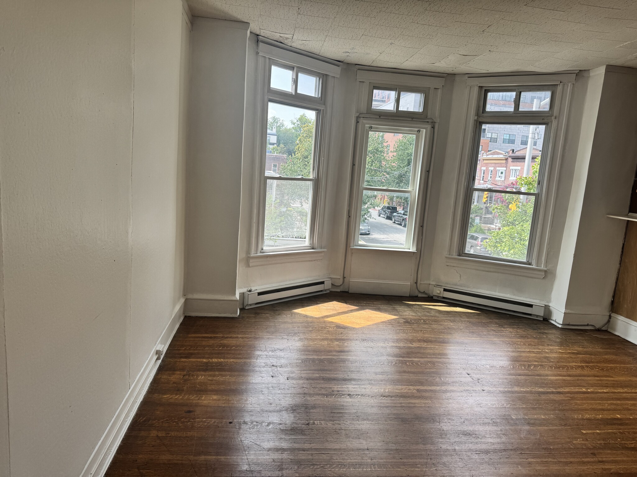 Large Living Room with Bay Windows - 3137 N Calvert St