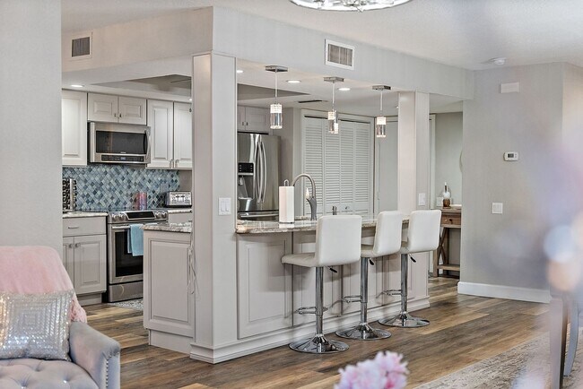 Building Photo - Two Bedroom/Two and a half bath gated townhome.