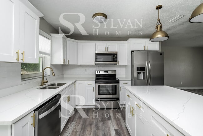 Building Photo - You Can Afford to Dwell Well.