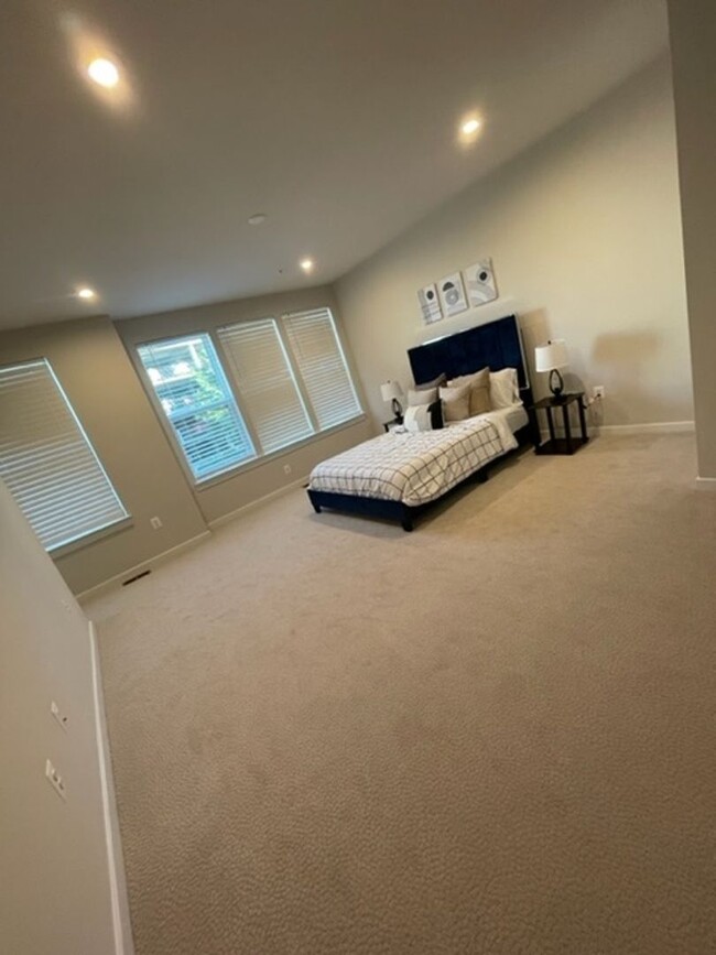 Building Photo - Modern 3BR Condo: Walk to Metro, 3 Miles f...