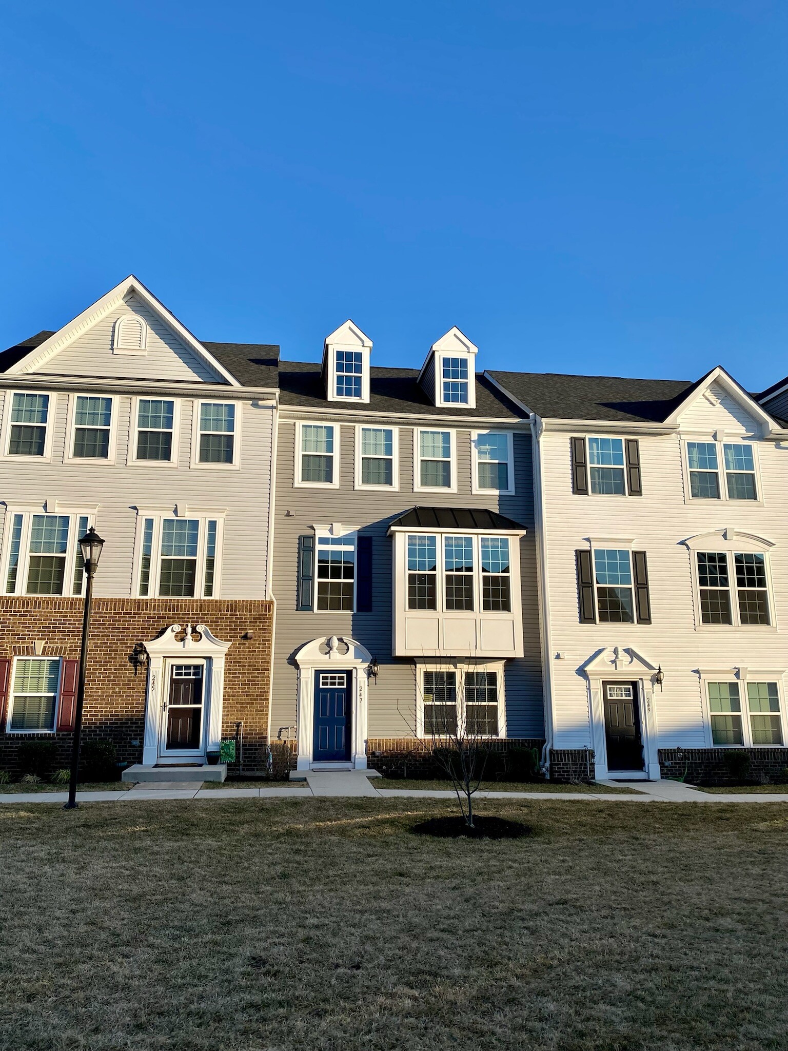 Unit entrance (gray w/blue door) - 247 Madison Ln