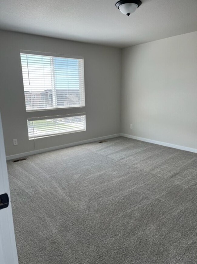 Building Photo - MODERN THREE STORY TOWNHOME WITH 2 CAR GAR...