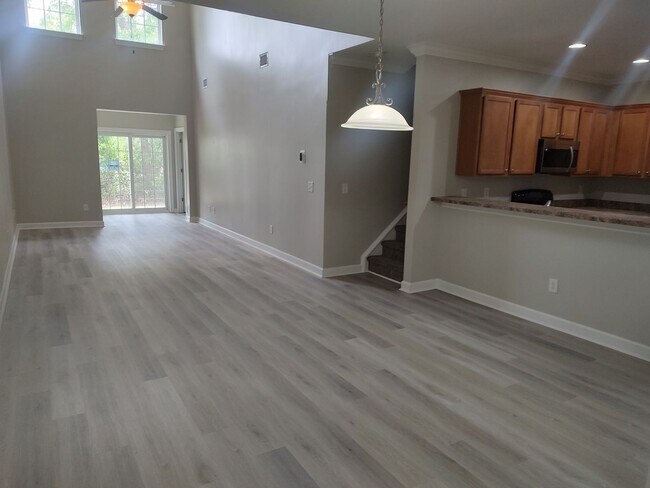 Building Photo - BRAND NEW FLOORING & FRESH PAINT - 3 Bedroom/2.5 Bath Townhome with garage in Wild Wing!