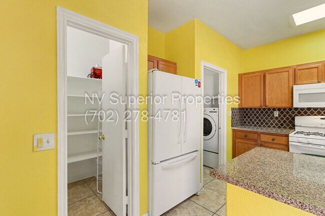 Building Photo - NW!! 4 Bedrooms!!! All Tile and Pergo flooring T/O!! NO Carpet!!! Low Maintenance Desert landscap...