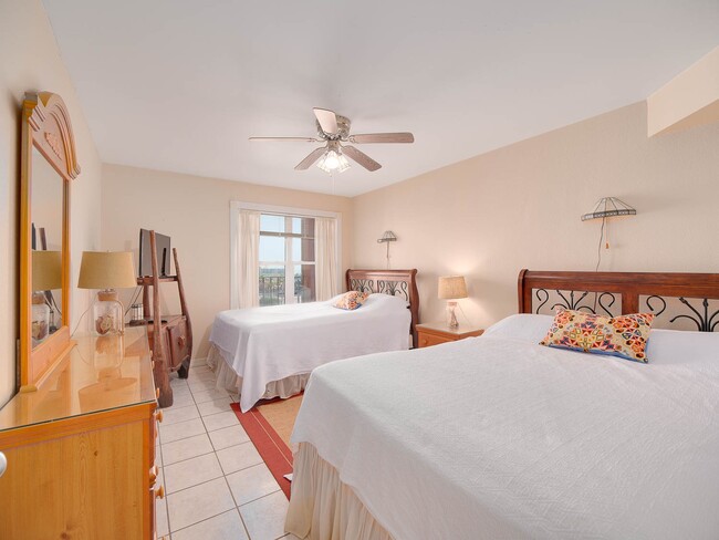 Guest bedroom with two queen beds - 130 Padre Blvd