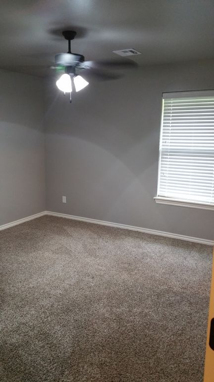 grey paint, bright bedroom - 127 Ashley Dr
